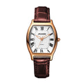 Women's quartz watch with bronze-tone curved case, white dial, Roman numerals, and brown leather strap.