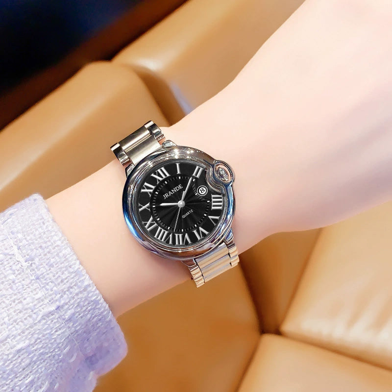 Women's quartz watch with black dial, silver stainless steel band, and Roman numerals.