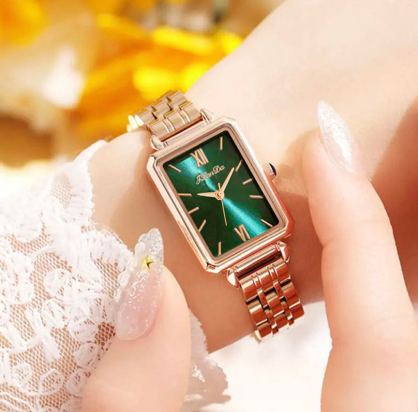 JRANDE J8201L Women's Quartz Watch | Ultra-Slim Stainless Steel | Water Resistant with a rectangular green dial and rose gold stainless steel bracelet worn on a wrist.